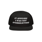 The Overreacting Hat is a black snapback with white embroidery reading It appears I was not overreacting, symbolizing resista