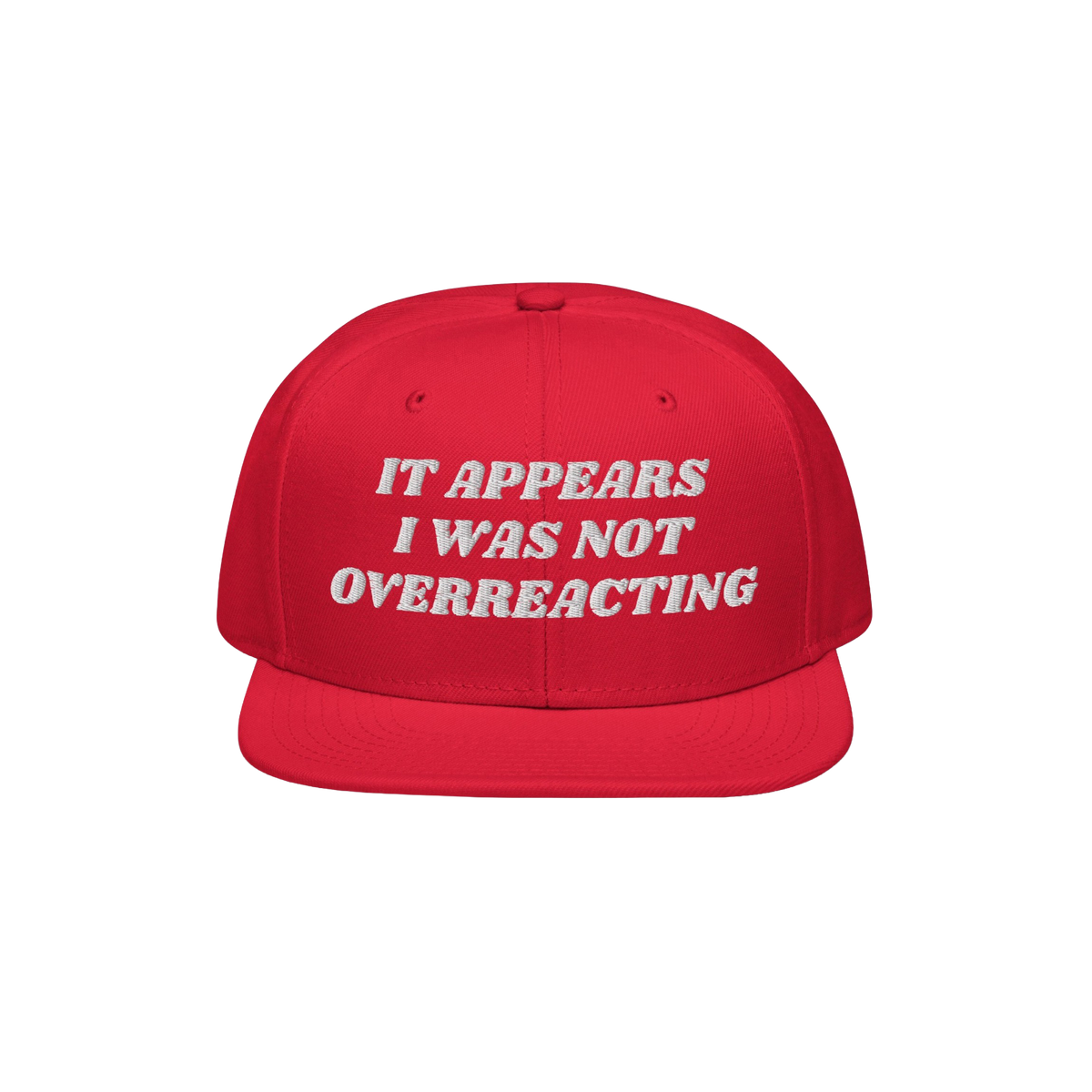 The Overreacting Hat features bold white embroidery on a red flat-brim cap, designed for progressives advocating against extr