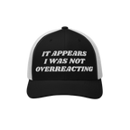 Overreacting Hat: A black-and-white mesh trucker cap with It Appears I Was Not Overreacting in raised white embroidery, symbo