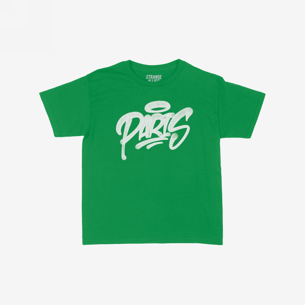 Paris Handstyle Women's Baby Tee features a bold, graffiti-style “PARIS” with a halo over the “P” on a green T-shirt, embodying a vibrant, rebellious spirit.