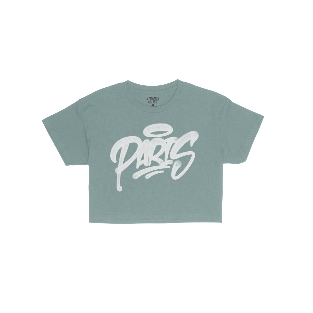 Paris Handstyle Women's Baby Tee in navy blue, featuring white graffiti-style PARIS with a halo graphic. Laid flat, it offers