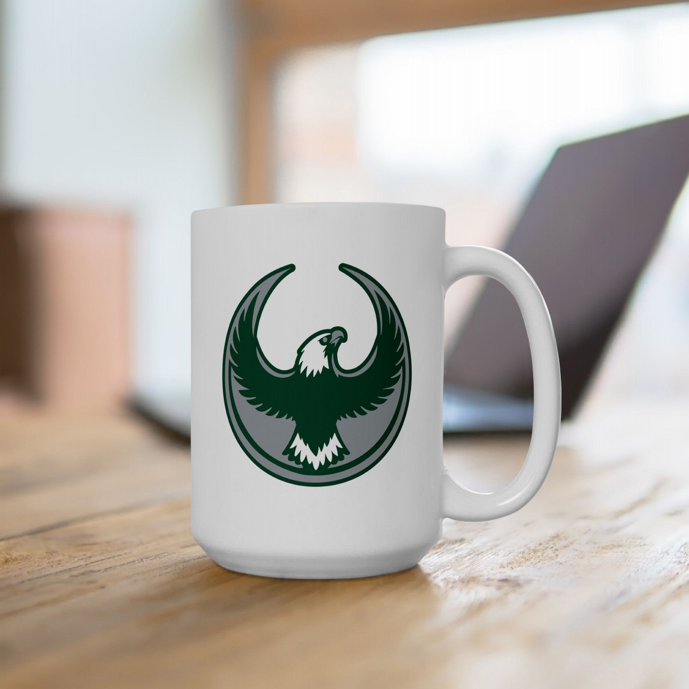 Philly Rebel Alliance Mug featuring a stylized eagle emblem, perfect for protest and equality advocates. The white ceramic mug, ideal for organizers, is both dishwasher and microwave-safe.