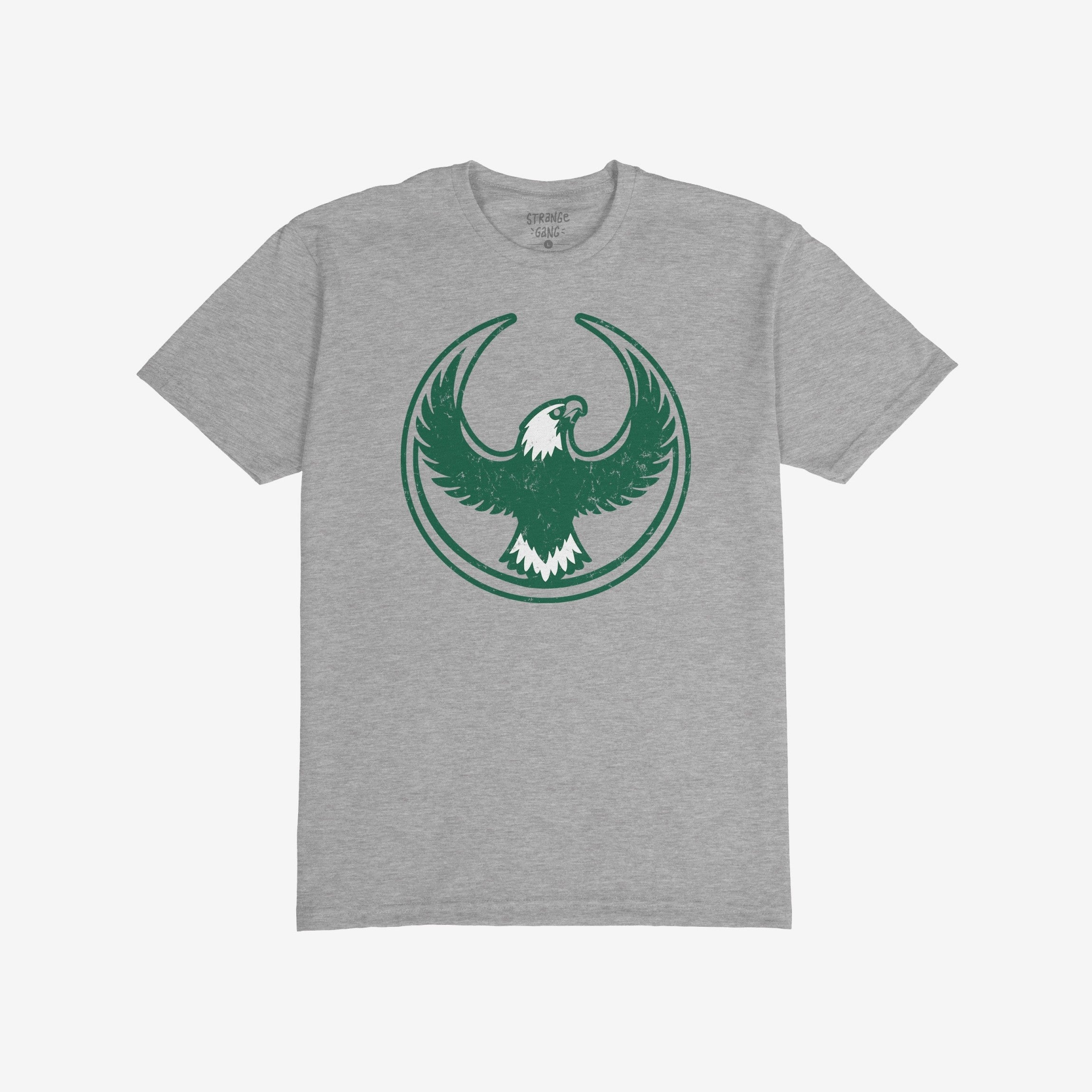 Heather-gray Philly Rebel Alliance T-shirt featuring a dark green stylized eagle with outstretched wings in a circular border, detailed with white accents, embodying anti-fascist and immigrant rights themes.