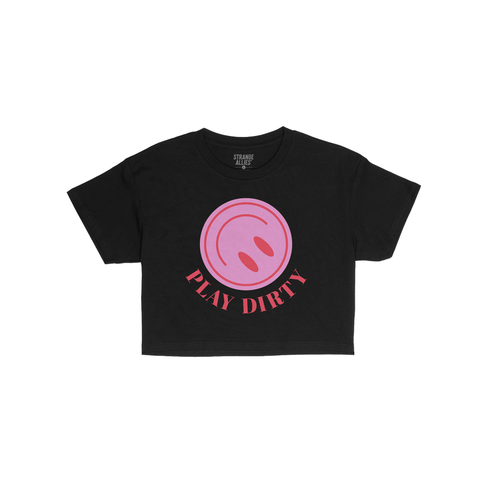 The Play Dirty Women's Baby Tee features a bold pink circle with red ovals and PLAY DIRTY in red, embodying a flirty, edgy st