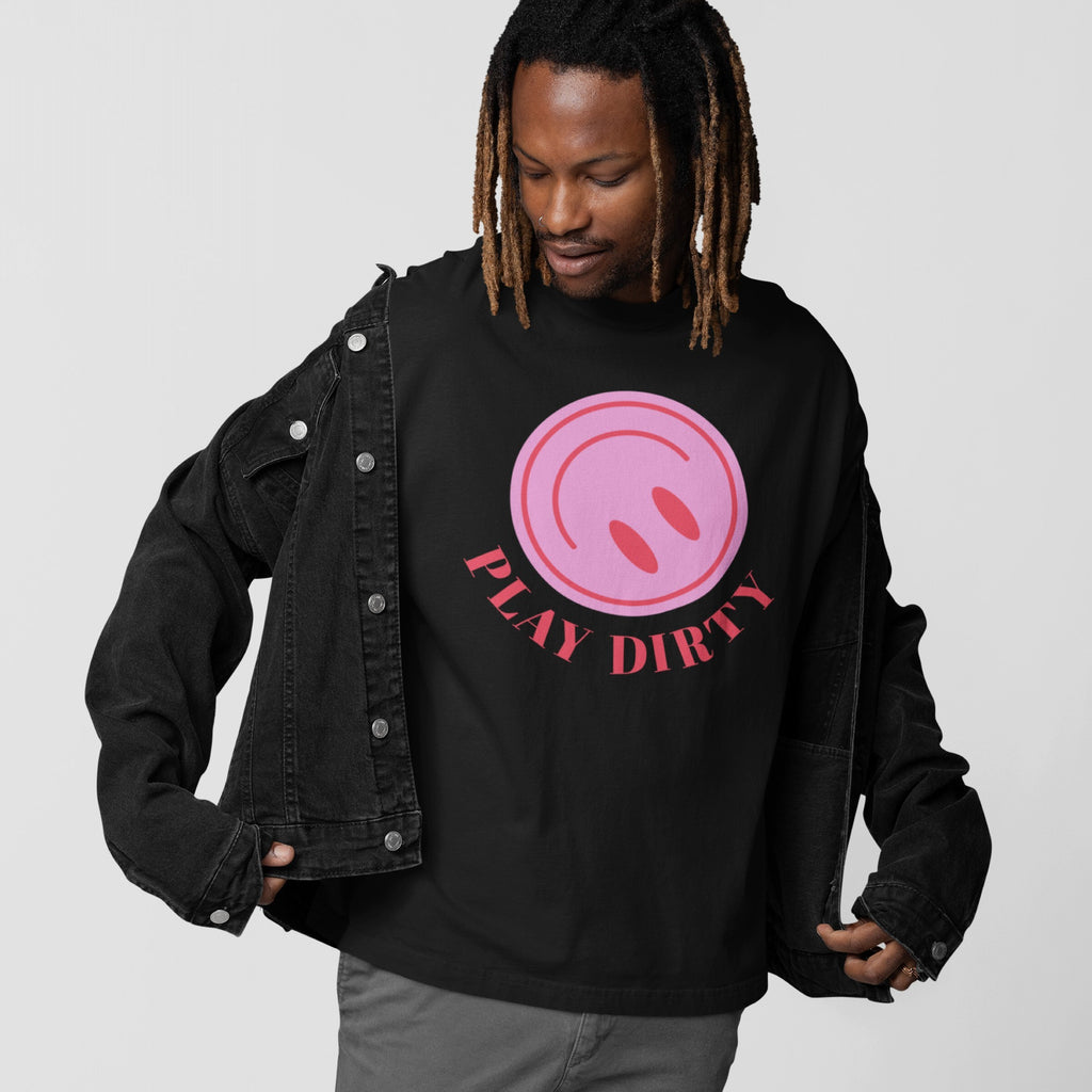 Young man with dreadlocks and a nose ring wearing a black denim jacket and Play Dirty T-shirt featuring a pink graphic, embodying bold, playful energy and rebellious spirit for chaos lovers.