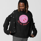 Young man with dreadlocks and a nose ring wearing a black denim jacket and Play Dirty T-shirt featuring a pink graphic, embodying bold, playful energy and rebellious spirit for chaos lovers.