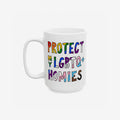 Protect My LGBTQ+ Homies Mug featuring a slogan in vibrant pride colors on a white ceramic background, embodying solidarity and allyship. Perfect for daily use or as a meaningful gift.
