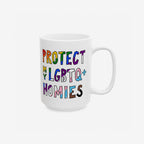 Protect My LGBTQ+ Homies Mug features vibrant, hand-drawn letters with Pride color schemes on a white ceramic surface, symbolizing solidarity and support for the LGBTQ+ community.