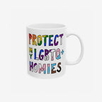 Protect My LGBTQ+ Homies Mug featuring hand-drawn, block-style letters in pride colors. This ceramic mug symbolizes solidarity and support, perfect for daily use or gifting. Dishwasher-safe with a shiny finish.