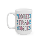 White ceramic Protect My Trans Homies mug with chunky hand-lettered slogan in trans pride colors, advocating for trans rights