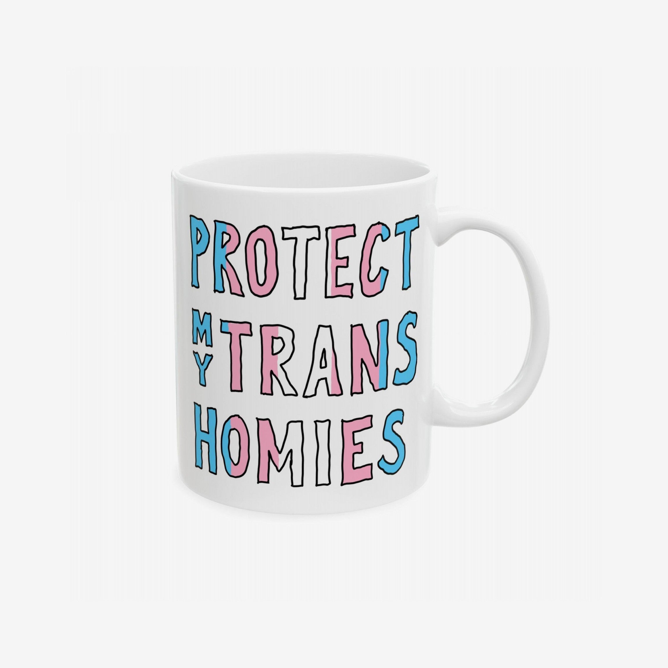 Protect My Trans Homies Mug features hand-drawn lettering in pride colors, symbolizing solidarity and support for trans rights. This ceramic mug is dishwasher-safe and available in 11 oz. and 15 oz. sizes.