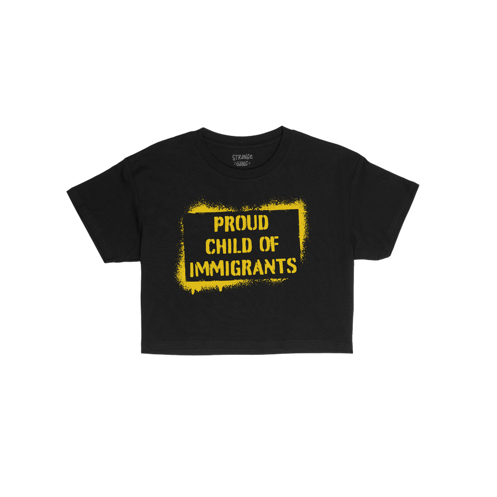 Proud Child Of Immigrants Women's Baby Tee featuring bold yellow stencil-style text, celebrating cultural heritage and identi