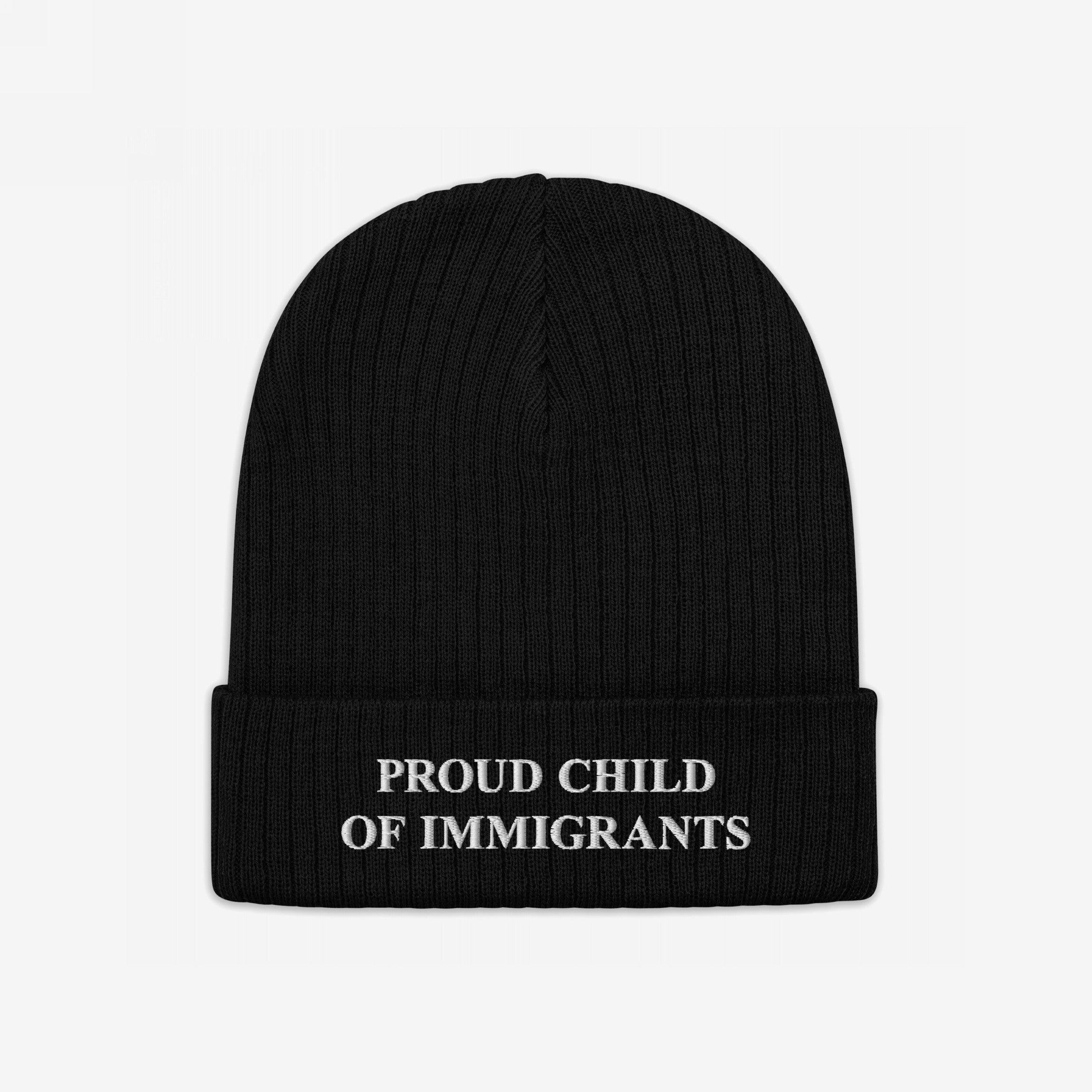 Black rib-knit beanie with “PROUD CHILD OF IMMIGRANTS” embroidered in white, symbolizing identity and heritage. A statement piece for those honoring family journeys with pride and resilience.
