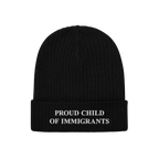 Black rib-knit beanie with “PROUD CHILD OF IMMIGRANTS” embroidered in white, symbolizing identity and heritage. A stateme