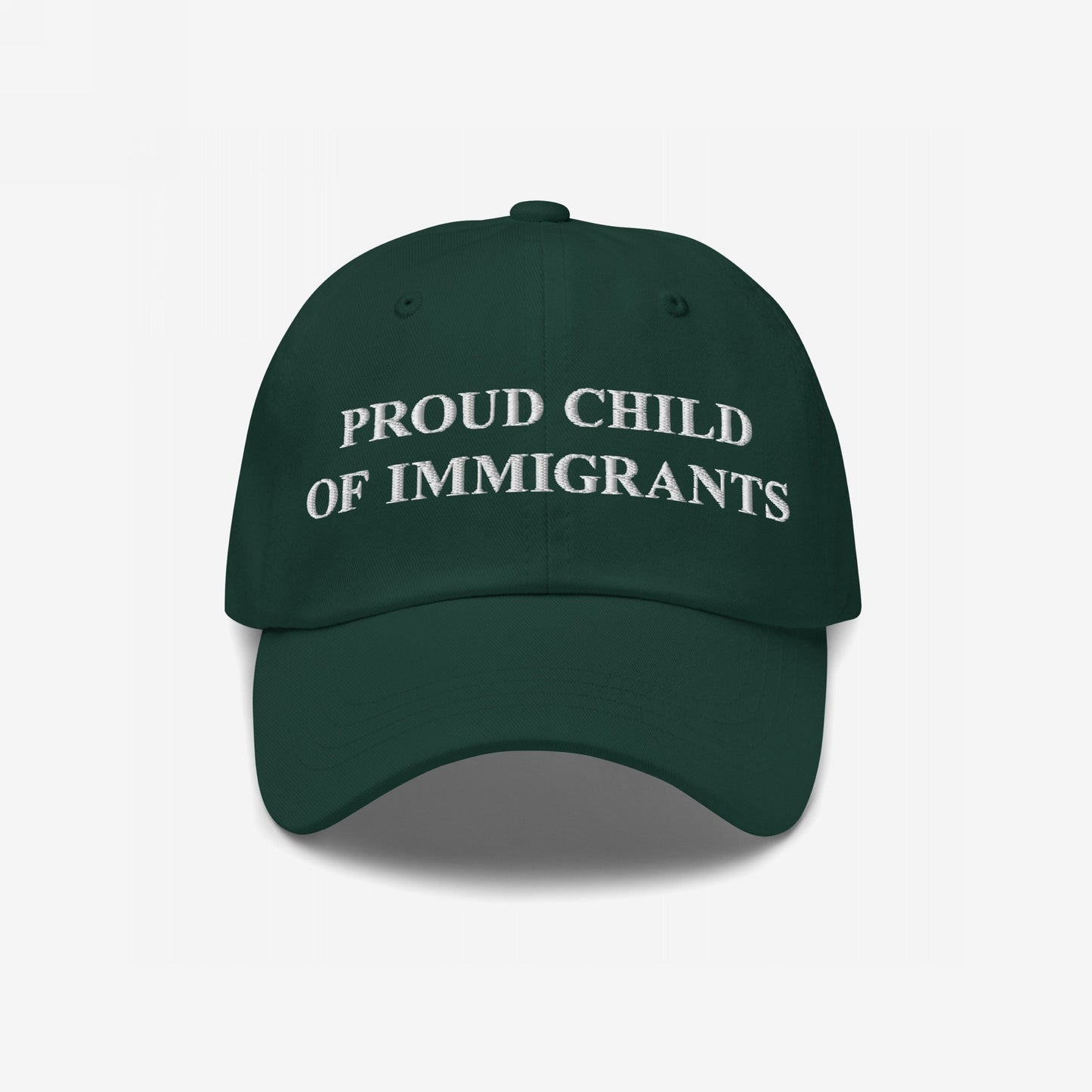 Dark green six-panel cap, PROUD CHILD OF IMMIGRANTS embroidered in white, symbolizing pride and resilience, reflecting the ethos of standing against injustice and celebrating identity.