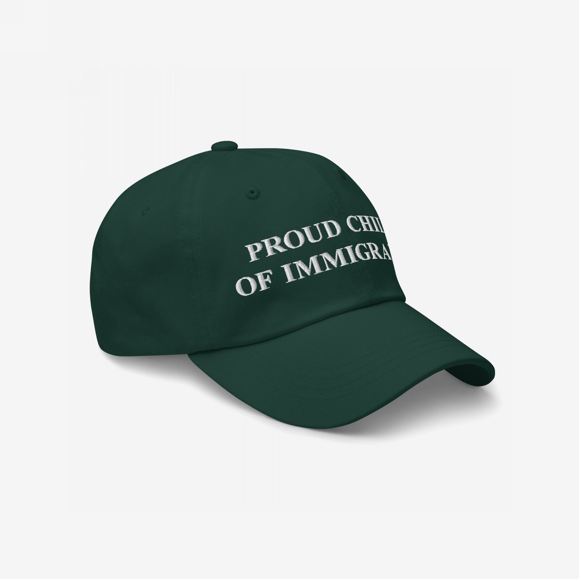 Dark green cap with PROUD CHILD OF IMMIGRANTS embroidered in white, symbolizing resilience and pride.