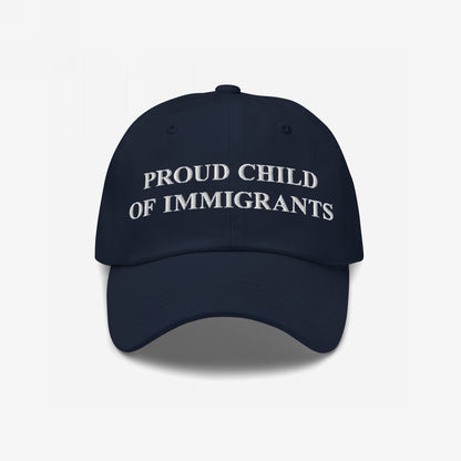 Proud Child of Immigrants Hat features white embroidered lettering, symbolizing identity and heritage, perfect for those honoring their family's journey with pride and resilience.