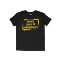 Black T-shirt featuring bold, yellow stencil-style text: PROUD CHILD OF IMMIGRANTS within a painted rectangle, symbolizing de