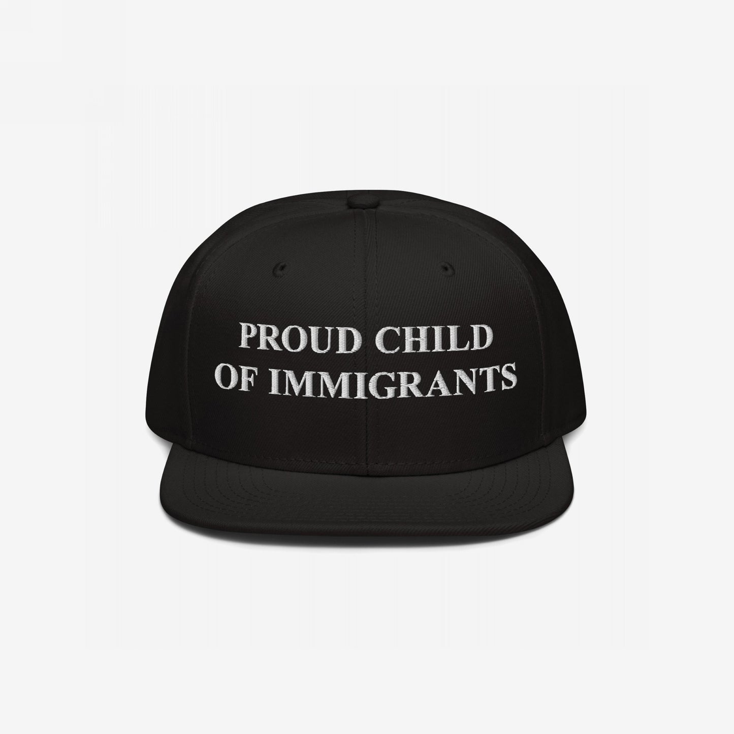 The Proud Child Of Immigrants Hat features bold, white embroidery on a black snap-back cap, symbolizing heritage and resilience, perfect for those honoring their immigrant roots with pride.