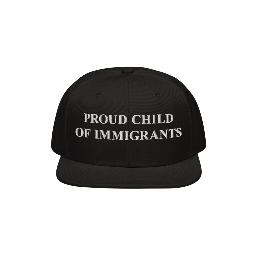 The Proud Child Of Immigrants Hat features bold, white embroidery on a black snap-back cap, symbolizing heritage and resilien
