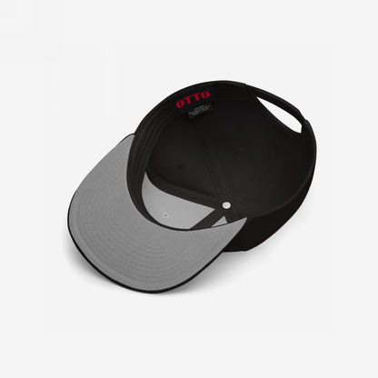 Inside view of the Proud Child of Immigrants Hat by OTTO, showcasing the black six-panel design, grey underside of the visor, and interior label, symbolizing identity and heritage with minimalist embroidery.