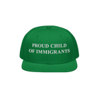 Proud Child of Immigrants Hat: A bright green snapback with bold white embroidery, symbolizing identity and heritage, perfect