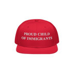Red snapback cap with PROUD CHILD OF IMMIGRANTS in white embroidery, symbolizing identity and heritage. Represents resilience
