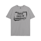 Light-gray short-sleeve T-shirt with the bold statement PROUD CHILD OF IMMIGRANTS in black stencil-style, celebrating family 