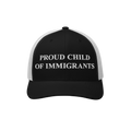 Black-and-white trucker cap with PROUD CHILD OF IMMIGRANTS embroidered on the front, symbolizing identity and heritage, echoi