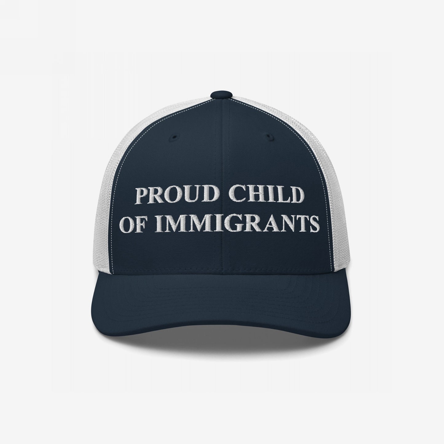 Navy-blue and white mesh trucker cap with PROUD CHILD OF IMMIGRANTS embroidered in white, symbolizing identity and resilience, aligning with themes of equality and pride.