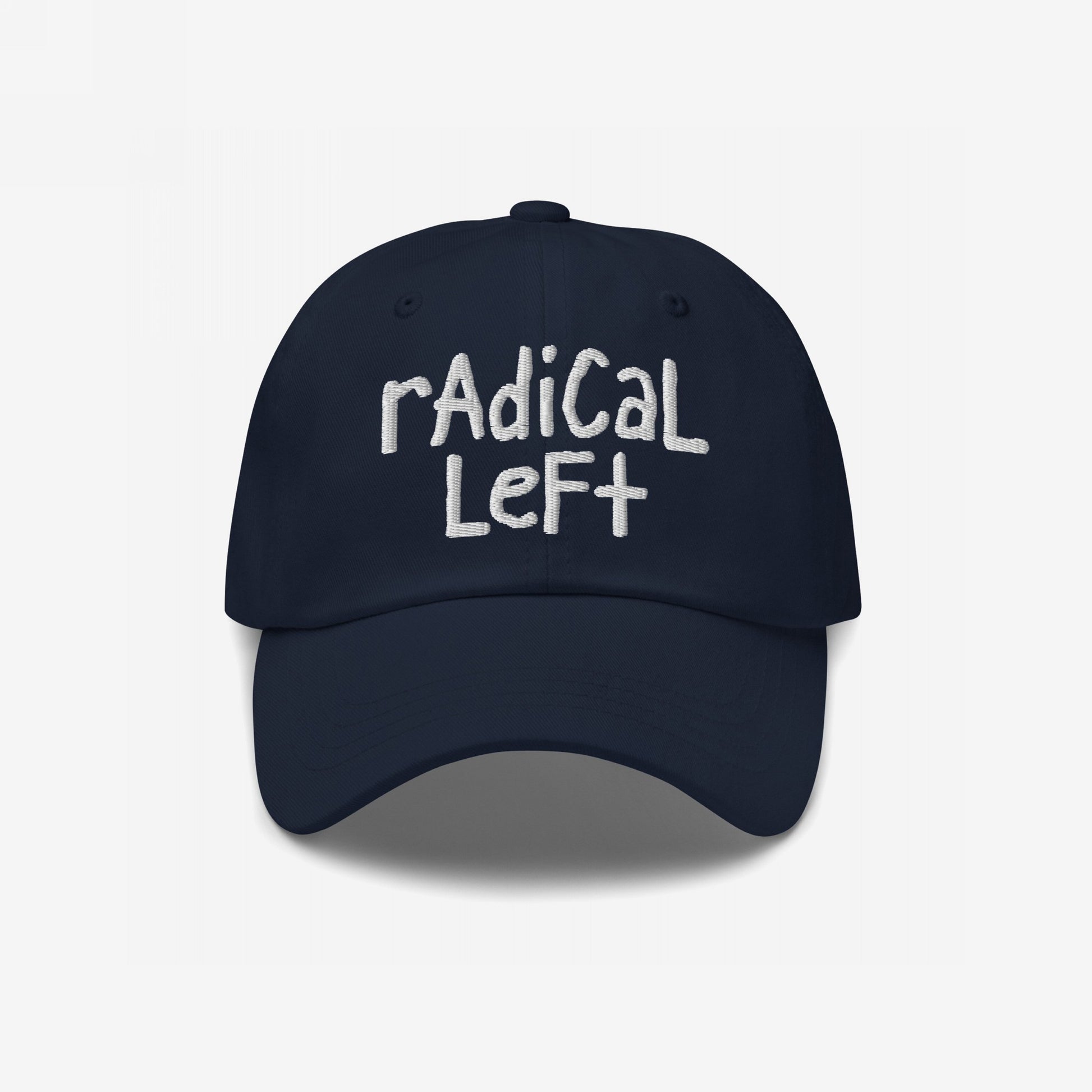 Navy-blue Radical Left Hat with white hand-lettered embroidery, symbolizing progressive values and resistance, featuring a laid-back dad-style fit.