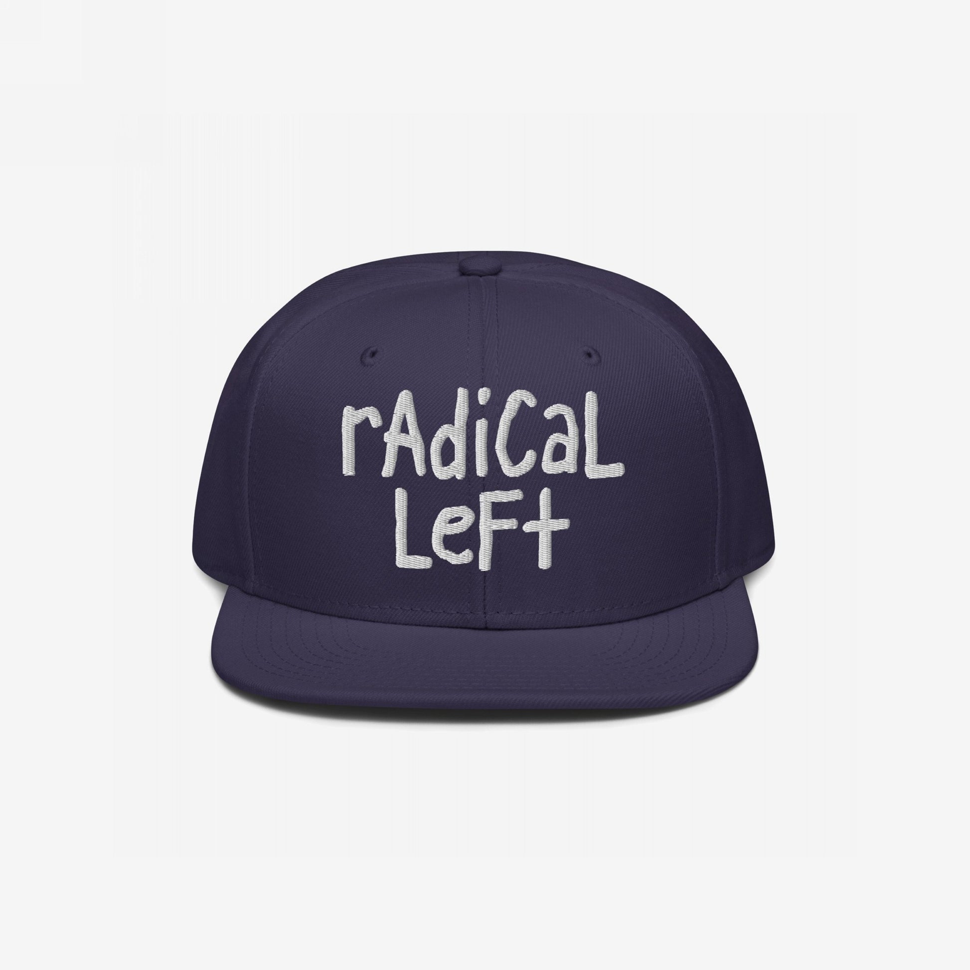 Navy blue Radical Left Hat with radical left in off-white, hand-drawn embroidery. The flat-brimmed cap embodies defiance and progress, challenging norms with a laid-back, bold style.