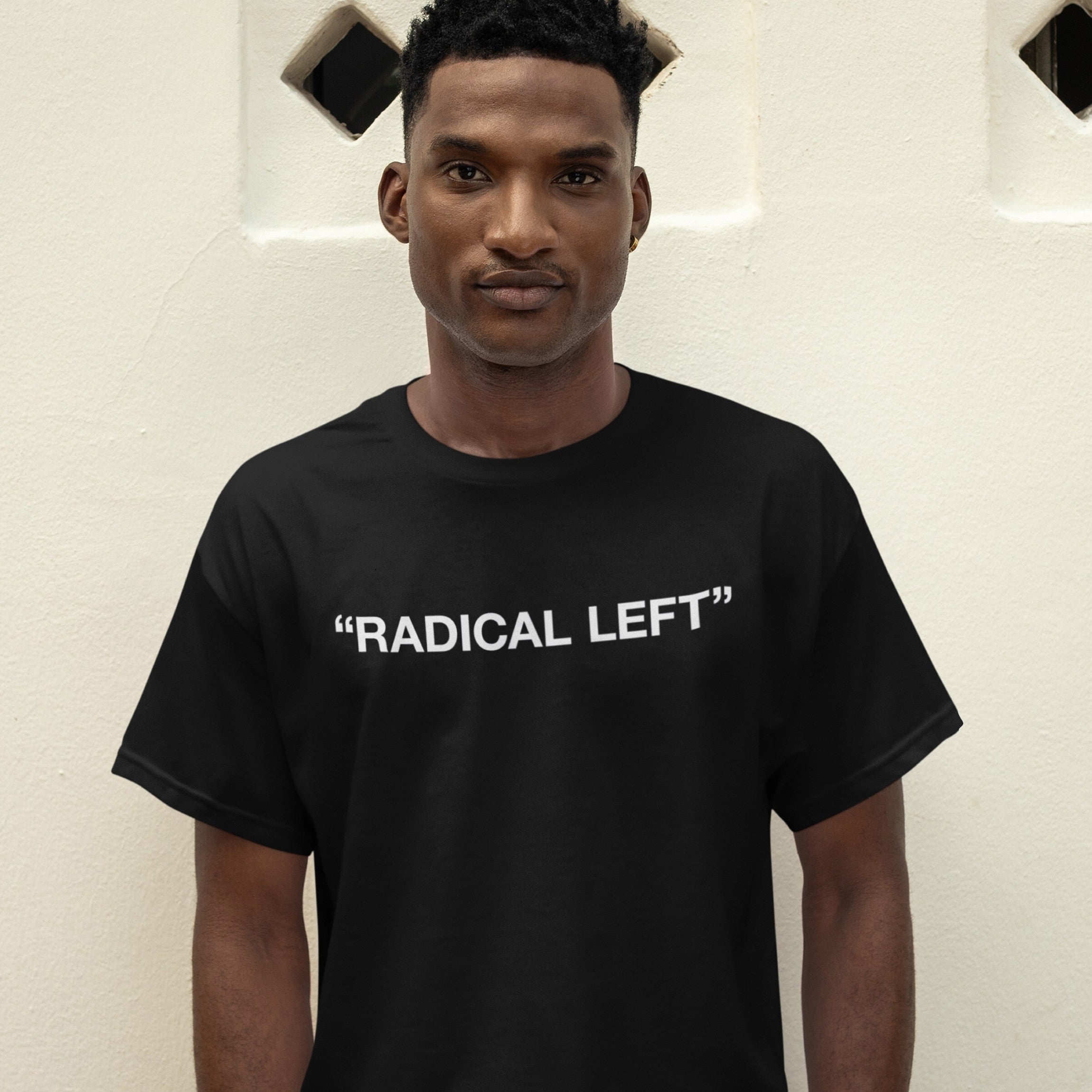 Man wearing the Radical Left T-shirt, featuring bold white text on black. The design embodies satire and solidarity, reflecting advocacy and empowerment.
