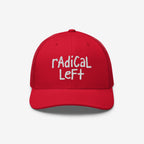 Red trucker-style baseball cap with white hand-lettered embroidery reading “rAdICAL LeFT,” symbolizing progressive values. This Radical Left Hat combines style with a bold message supporting human rights and equality.