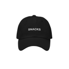 The Snacks Hat is a black dad hat with SNACKS embroidered in white, perfect for snack enthusiasts wanting to make a bold yet 
