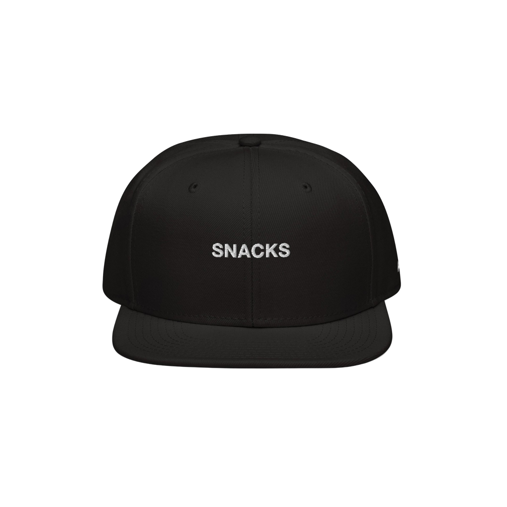 The Snacks Hat features a black flat-brimmed snapback with SNACKS embroidered in white, embodying a bold yet minimalist style