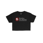 Snitches Get Stitches Women's Baby Tee features a bold graphic with a no talk icon and slogan, critiquing the healthcare syst