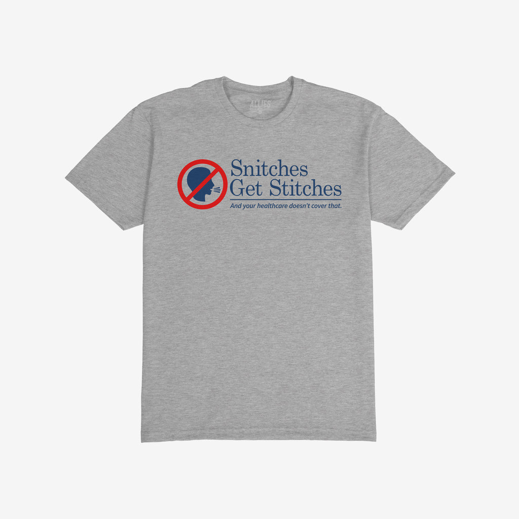 Snitches Get Stitches Shirt: Heather-gray crew-neck T-shirt featuring a red circle-and-slash over a profile icon, bold text Snitches Get Stitches with a humorous health insurance jab, reflecting loyalty and sarcasm.