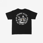 Social Club Women's Baby Tee features two skeletons clinking beer mugs, encircled by STRANGE ALLIES and WE'RE ALL IN THIS TOGETHER, capturing a playful, rebellious spirit.