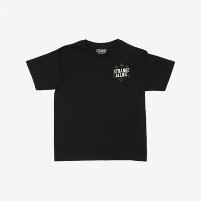 Social Club Women's Baby Tee, featuring a small STRANGE ALLIES graphic with gold sparkles on the chest, laid flat, showcasing its crew neck and short sleeves. Ideal for expressing individuality and unity.