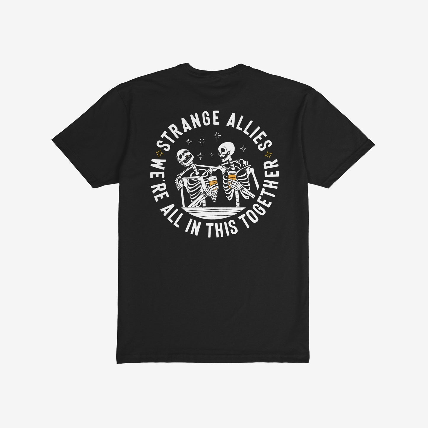Social Club T-shirt features two cartoon skeletons clinking beer mugs, encircled by the slogan STRANGE ALLIES and WE’RE ALL IN THIS TOGETHER, symbolizing unity and camaraderie.
