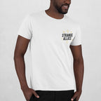 Social Club T-shirt on Black male model, featuring a small STRANGE ALLIES™ graphic with starbursts on front and skeletons clinking glasses on back, embodying unexpected connections and shared truths.