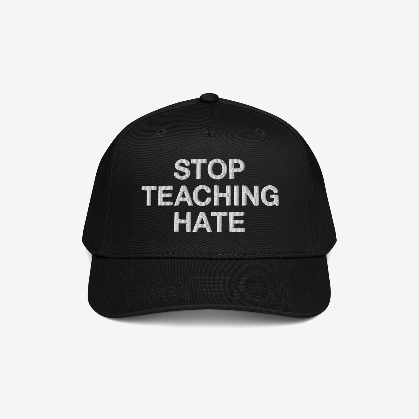 The Stop Teaching Hate Hat features bold white embroidery on a black cap, making a powerful statement against intolerance and promoting equality through its straightforward and impactful design.
