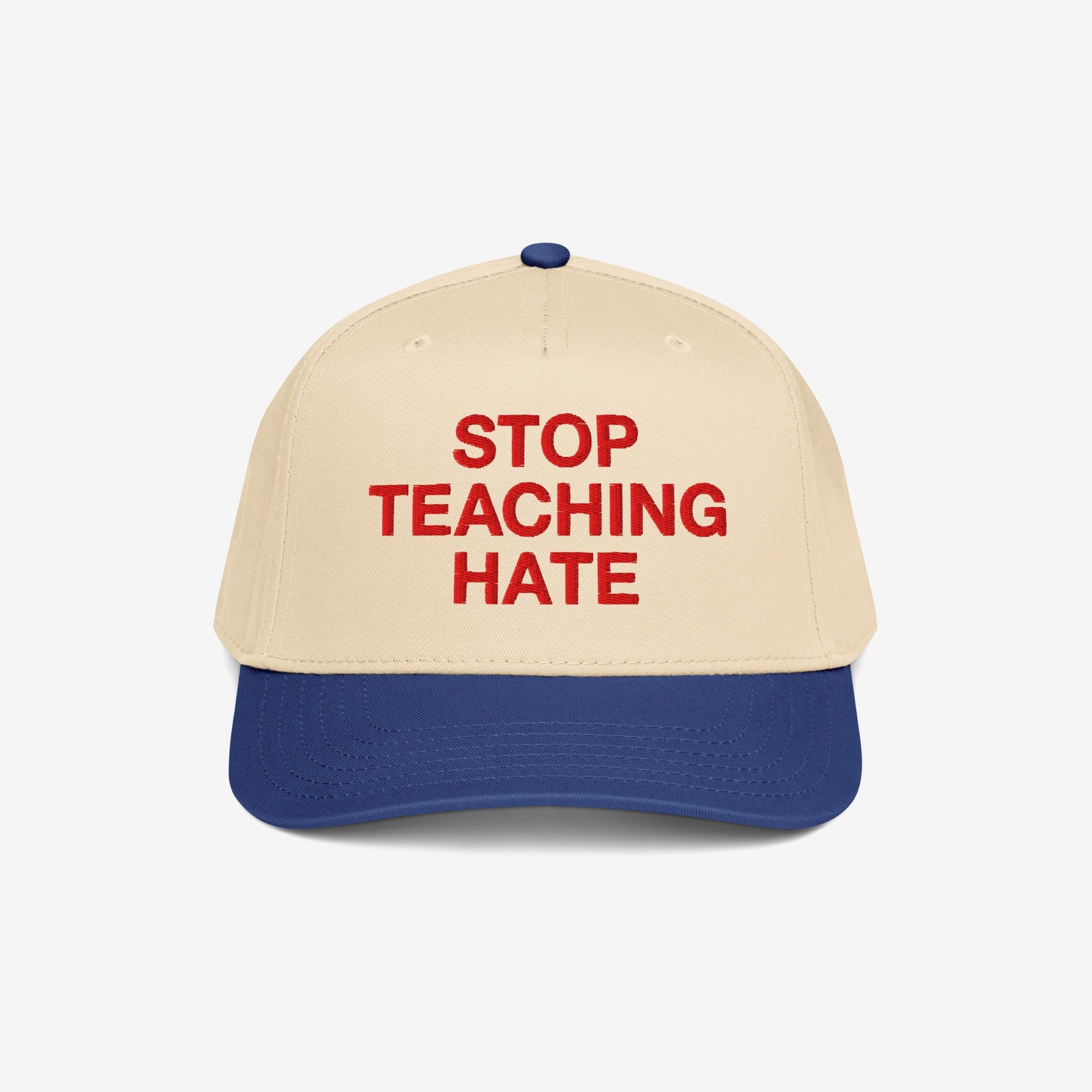 Stop Teaching Hate Hat with bold red embroidery on a two-tone baseball cap, symbolizing a strong stance against intolerance and promoting equality through impactful design.