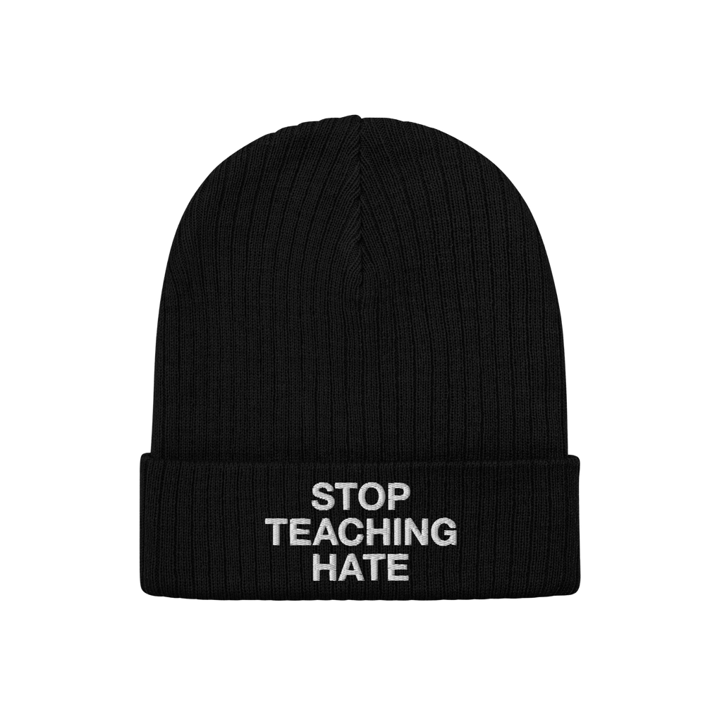 Black rib-knit beanie with STOP TEACHING HATE embroidered in white on the cuff, embodying a bold stance against hate.