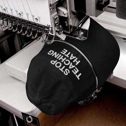 The Stop Teaching Hate Hat being embroidered on a machine, showcasing its bold anti-hate message, perfectly aligned with a commitment to equality and social justice.