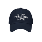 Dark navy baseball-style cap featuring STOP TEACHING HATE in white embroidery. The Stop Teaching Hate Hat embodies a bold sta