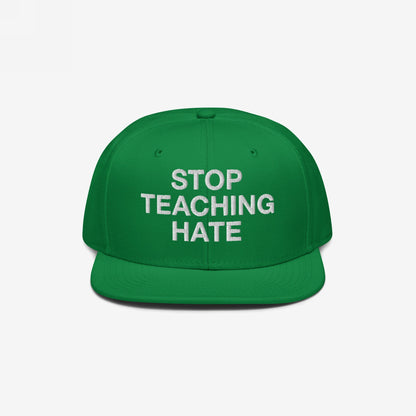 Green flat-brimmed baseball cap with STOP TEACHING HATE embroidered in white, symbolizing a bold stance against hate. Perfect for expressing values in everyday settings and activism.