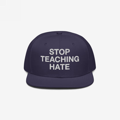Dark navy-blue, flat-brimmed Stop Teaching Hate Hat with bold white embroidery, embodying a strong anti-hate message, perfect for advocating equality and challenging intolerance in any setting.