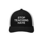 Black-and-white mesh-back baseball cap with STOP TEACHING HATE embroidered in white on the front panel, embodying a bold mess